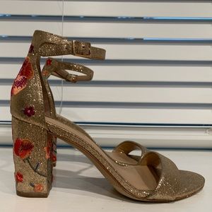 Slightly worn gold heels